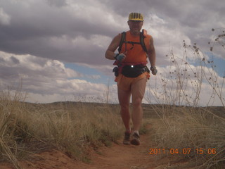 259 7j7. Canyonlands Lathrop hike/run - Adam running (tripod)