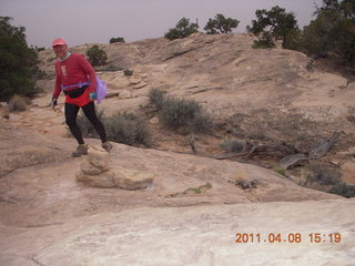 257 7j8. Canyonlands Needles Slickrock hike - Adam (tripod)