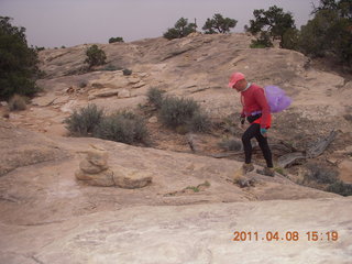259 7j8. Canyonlands Needles Slickrock hike - Adam (tripod)