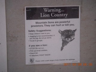 13 7j9. Arches Devil's Garden hike - mountain lion warning sign