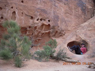 99 7j9. Arches Devil's Garden hike - Adam in hole in rock