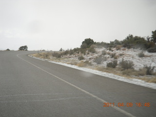 312 7j9. drive back from Dead Horse Point to Moab - hail (or something harder then rain or snow) on side of road