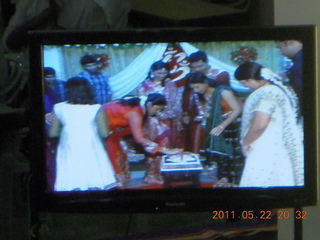 India - Randeep pre-wedding - cake cutting on TV monitor