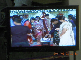 209 7kn. India - Randeep pre-wedding - cake cutting on TV monitor