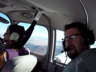 569 7ls. Kristina and Neil flying in N8377W