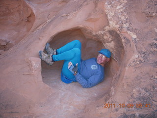 Arches National Park - Devil's Garden hike - Adam in hole in rock