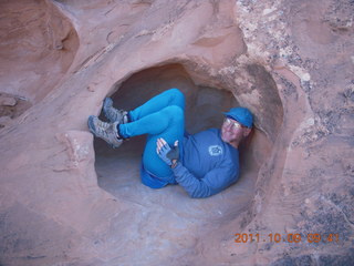 71 7q9. Arches National Park - Devil's Garden hike - Adam in hole in rock