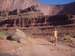 76 7qb. Canyonlands National Park - Lathrop trail hike - Adam running (tripod)