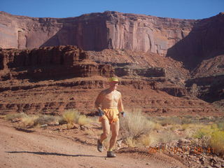 78 7qb. Canyonlands National Park - Lathrop trail hike - Adam running (tripod)