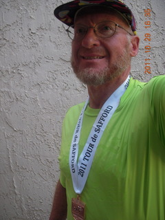 Adam with shirt and medal from Safford half-marathon race