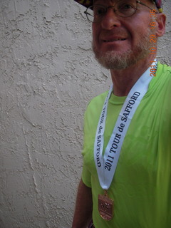 Adam with shirt and medal from Safford half-marathon race