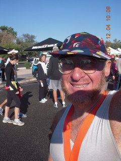 Adam with shirt and medal from Safford half-marathon race