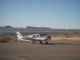 719 7sq. N8377W and solar panels (I think) at Bagdad Airport (E51)