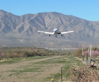 739 7u8. N8377W taking off at Bouquet Ranch