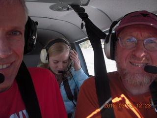 half of Jerry and Carolyn and Adam flying in N8377W