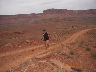 115 7x1. Canyonlands Murphy hike - Adam running (tripod)