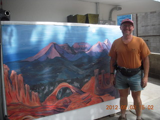 Adam and mural at Milt's Stop & Eat in Moab