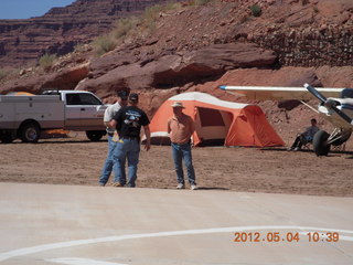 Caveman Ranch - people, tents, and airplanes