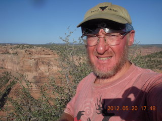 Spider Rock viewpoint - Adam with eclipse glasses squinting