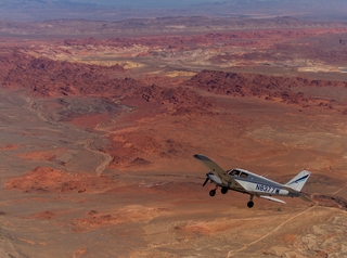 910 7y3. Greg A. photo - N8377W in flight