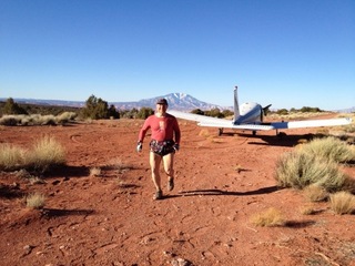 331 7zl. Tony's picture of N8377W at Nokai Dome airstrip with Adam running