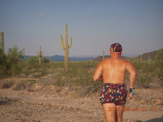 Adam running at Windmill airstrip (tripod, back)