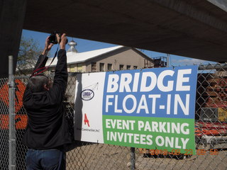 Hastings Bridge Float-In - Kevin G taking a picture over the sign
