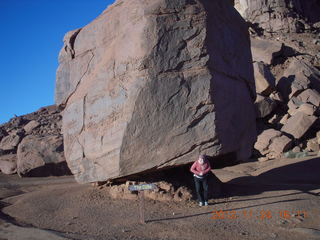 Monument Valley tour - Adam holding up cube rock, Atlas style