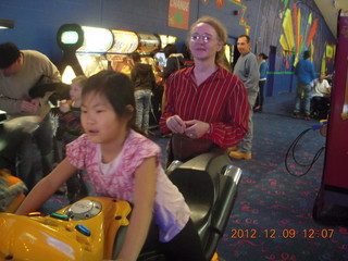 465 849. Cecelia playing video game and Betsy