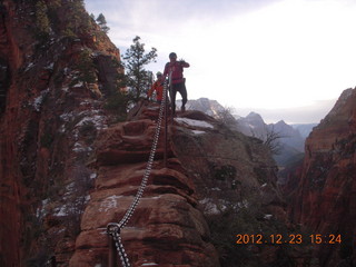 207 84p. Zion National Park - Angels Landing hike - Adam using chains