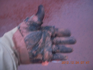 10 84q. my muddy hand after cleaning up rocks from road