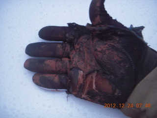 my muddy hand after cleaning up rocks from road