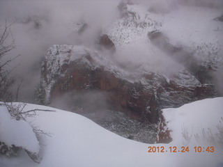 128 84q. Zion National Park - cloudy, foggy Observation Point hike - view of Angels Landing from top