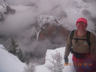 129 84q. Zion National Park - cloudy, foggy Observation Point hike - Adam at the top