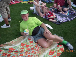 Adam watching baseball game with rainbow ice cone