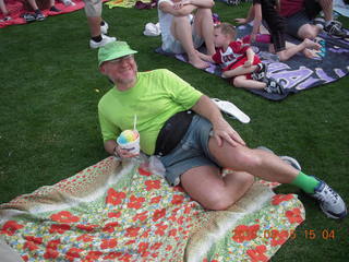 Adam watching baseball game with rainbow ice cone