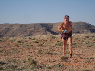 114 87y. Adam running at Grand Gulch (tripod and timer)