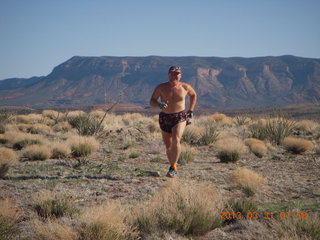 117 87y. Adam running at Grand Gulch (tripod and timer)