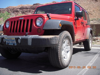 dirty red Jeep
