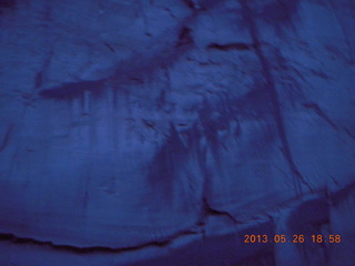 night boat ride along the Colorado River - woman's face in the rock markings