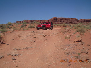 116 89t. Chicken Corner drive - my red Jeep driving down a hill