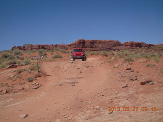 117 89t. Chicken Corner drive - my red Jeep driving down a hill