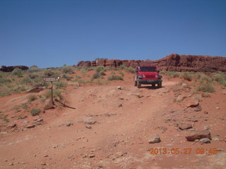118 89t. Chicken Corner drive - my red Jeep driving down a hill
