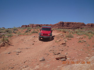 120 89t. Chicken Corner drive - my red Jeep driving down a hill