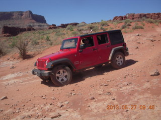 122 89t. Chicken Corner drive - my red Jeep driving down a hill