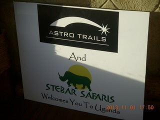 217 8f1. Uganda - Chobe Sarari Lodge - Astro Trails sign