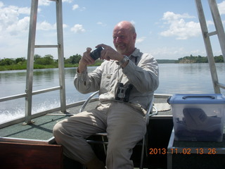 243 8f2. Uganda - Murcheson Falls National Park boat ride - Steve taking a picture