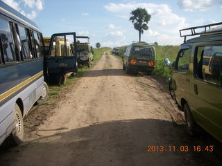 110 8f3. Uganda - eclipse site - vans and buses