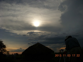 Uganda - eclipse site - sun behind clouds