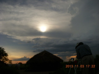 184 8f3. Uganda - eclipse site - sun behind clouds